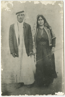 A portrait of a married couple in traditional dresses