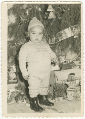 A child in front of the Christmas tree