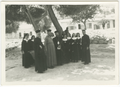 A group of nuns and priests with Bishop Simon Arafa