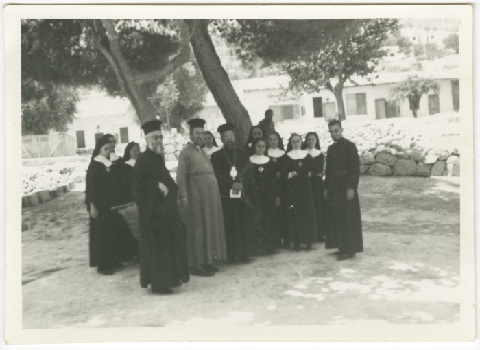 A group of nuns and priests with Bishop Simon Arafa