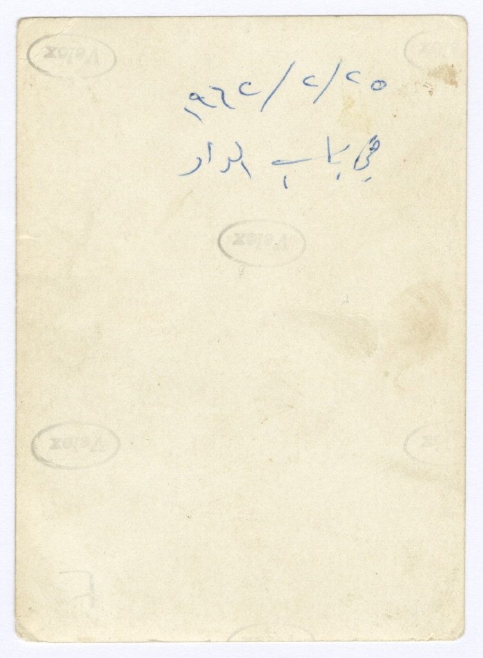 A mother in the traditional dress with two of her children