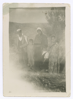 A mother with her children in Silwad Village