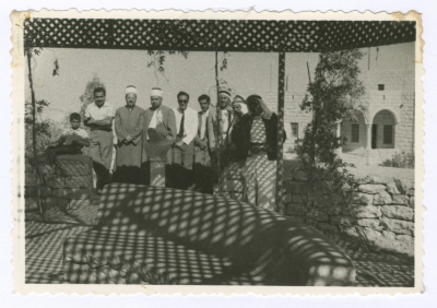 Legal persons  under the pergola at the house of the Sheikh of the Ta