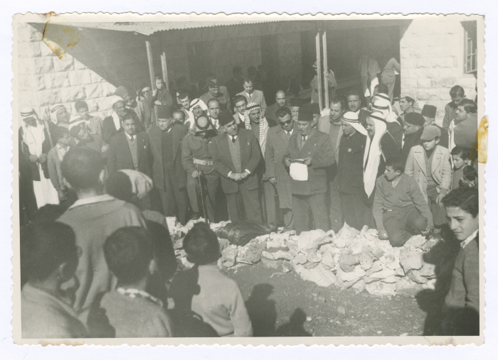 A man giving a speech on Arbor Day
in front of a delegation; on their visit to the Mental Health Hospital/Bethlehem
