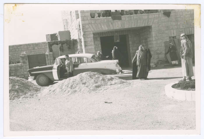 Men in front of the house of the Sheikh of the Ta'amreh Family