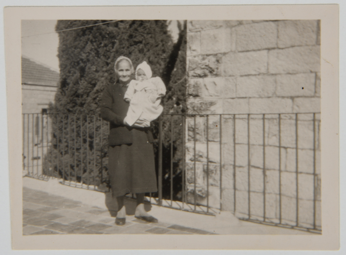 Naifah Qab'ein/Ashrawi holding baby Nano (Naifah Ashrawi)