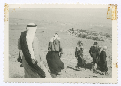 People headed to distribute dates at al-Mahatta