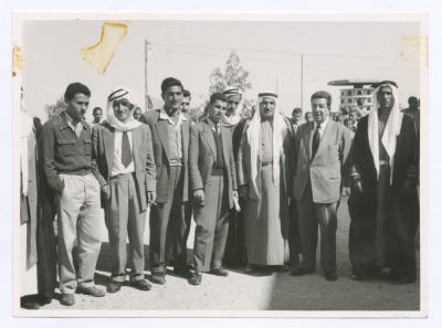 A photograph of men after the Lutheran Union distributed clothes to school students