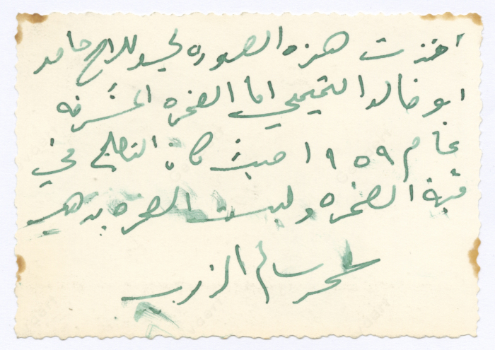 Two men in front of the Dome of the Rock; being painted with gold