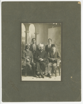 Abdel Salam Al-Barqawi; seated first to the right, with other political figures