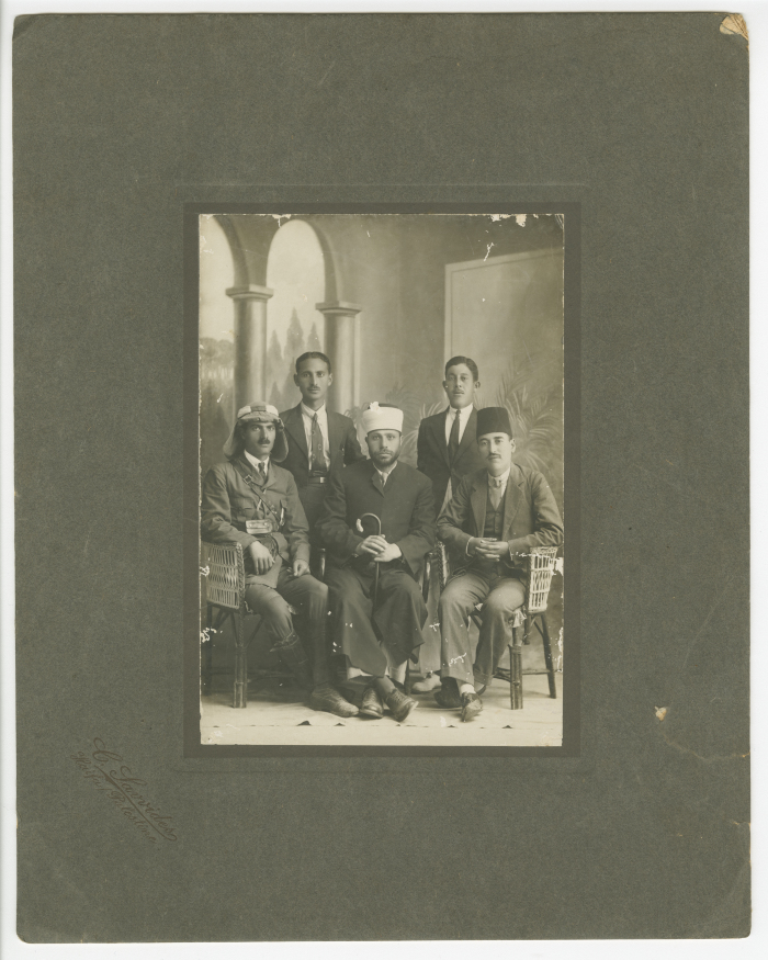 Abdel Salam Al-Barqawi; seated first to the right, with other political figures