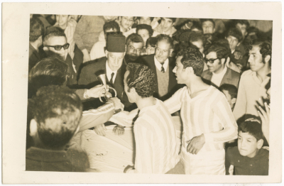 A football player receives the cup