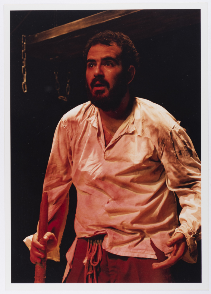 A Photograph of Amer Hlehel on Stage During the Theatrical Performance of 