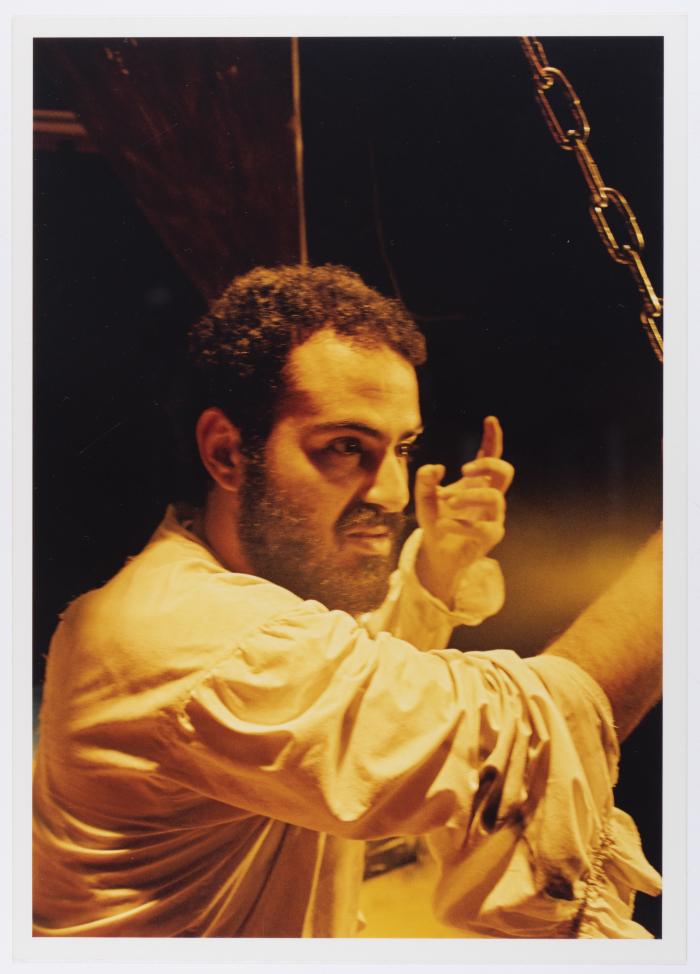 A Photograph of Amer Hlehel on Stage During the Theatrical Performance of 