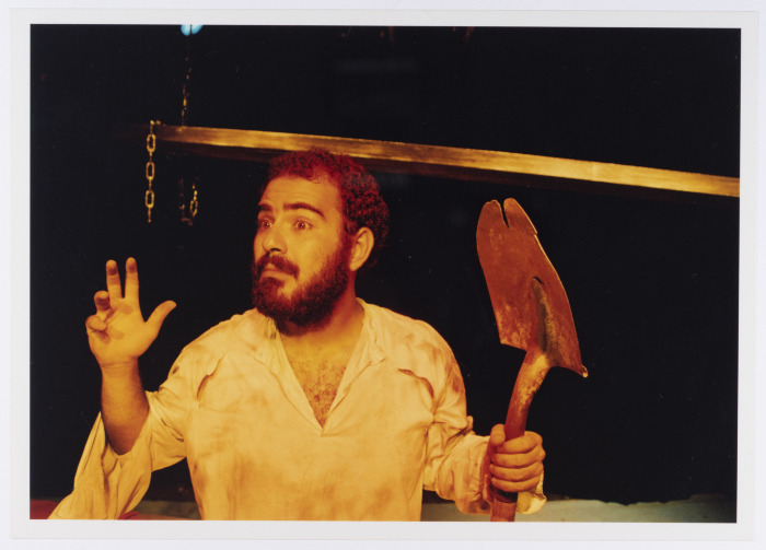 A Photograph of Amer Hlehel on Stage During the Theatrical Performance of 