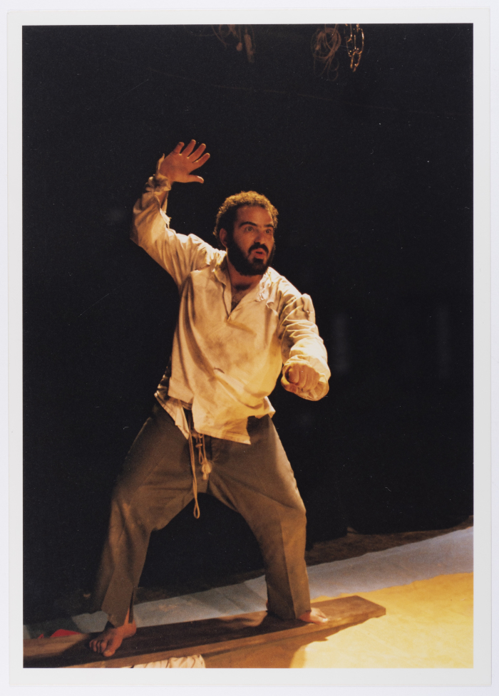 A Photograph of Amer Hlehel on Stage During the Theatrical Performance of 