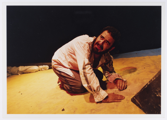 A Photograph of Amer Hlehel on Stage During the Theatrical Performance of 