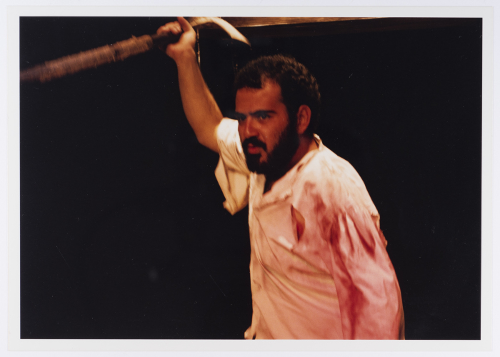 A Photograph of Amer Hlehel on Stage During the Theatrical Performance of 