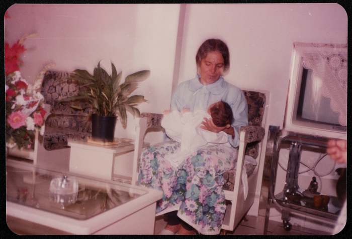 A Woman Carrying an Infant 