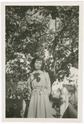 A Girl Standing under the Shadow of a Tree