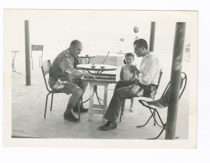 Two Men Playing Backgammon
