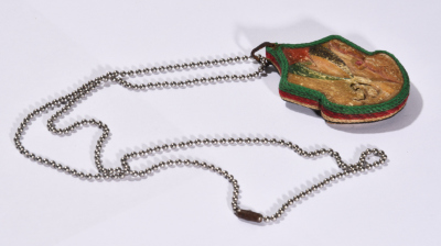 A Necklace of a Wooden Piece with the Engraving of Fateh Movement's Logo