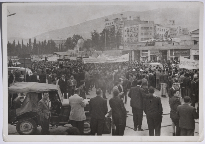 A crowd of demonstrators standing in the streets of Syria's capital 