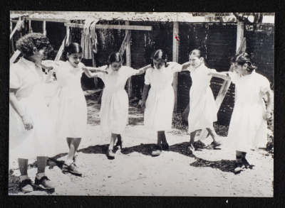 A Photograph of Girls Dancing Dabke at Rawdat el-Zuhur School in al-Quds, 1960