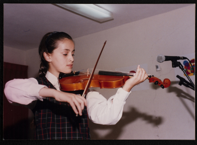 A Photograph of a Student Playing the Violin 