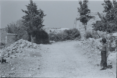 A Child in Front of an Old House in Kobar, Ramallah 