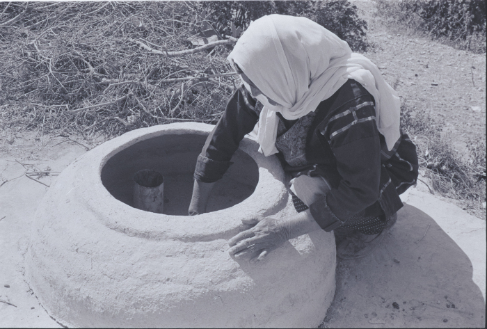 A Woman Making Taboon Bread in Kobar, Ramallah
