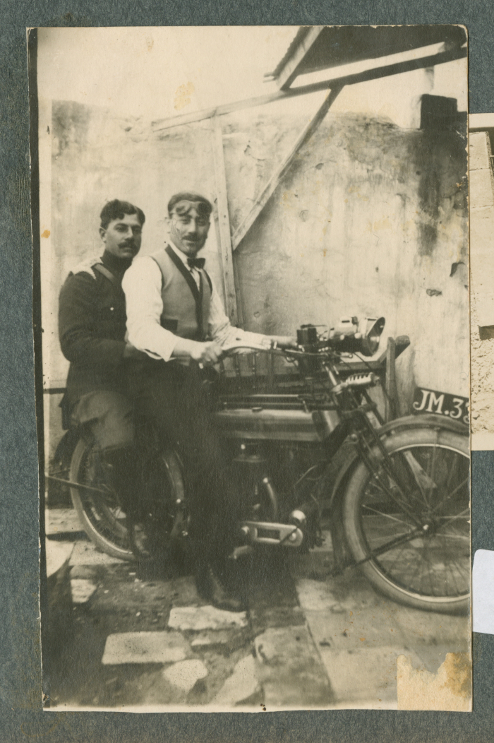 A Photograph of Two Men Riding a Bike Together, 1900 - 1960