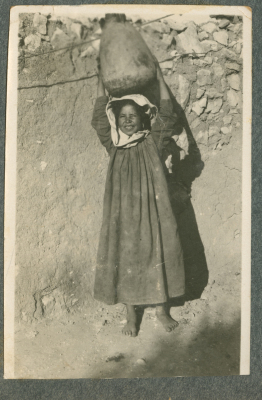 A Photograph of a Girl Carrying a Jar on Her Head, [1910 - 50?]