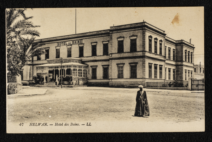 A Postcard Featuring a Photograph of a Hotel