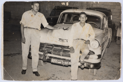 Driver Ghaleb Qzaih in Front of Etimad Taxi Service
