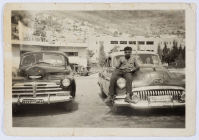 Etimad Taxi Service Taxis and a Driver 