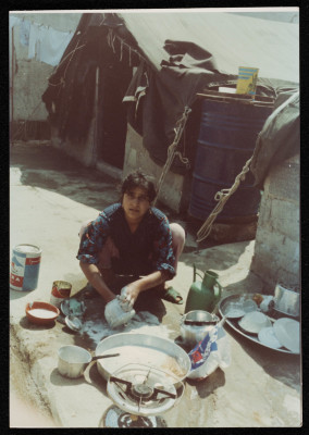 A Woman Washing Dishes in al-Beddawi Camp for Palestinian Refugees 