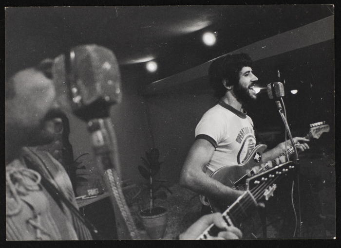 A Photograph of Samir Ashrawy Plays His Guitar at One of Al-Bara'em's Shows in Ramallah, 1973