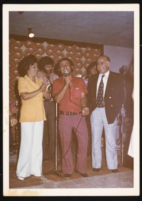 A Photograph of Muṣtafa al-Kurd Singing with Al-Bara