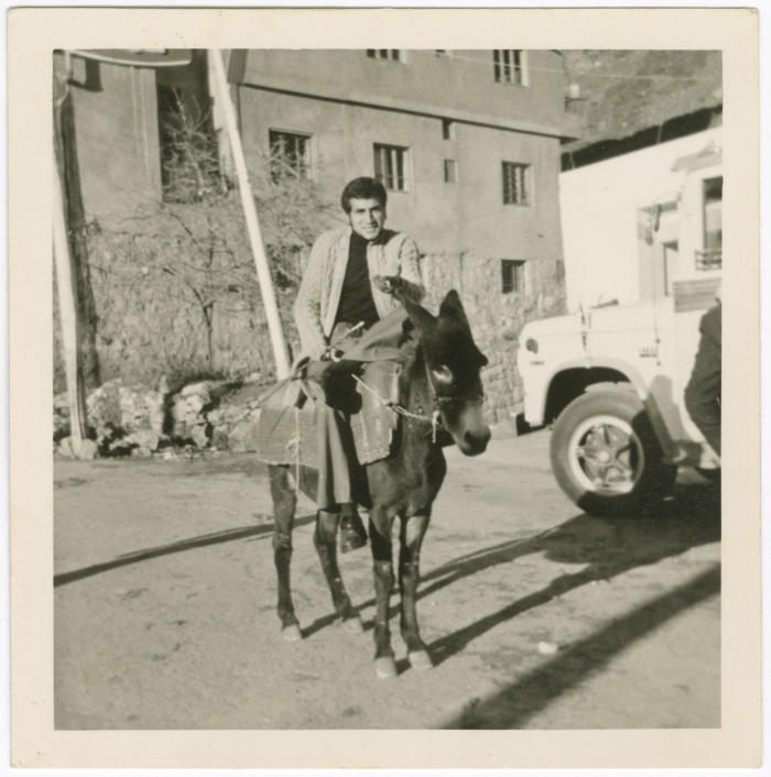 A Photograph of Hasan abu Khdair Riding a Donkey in Bsharri, Lebanon 