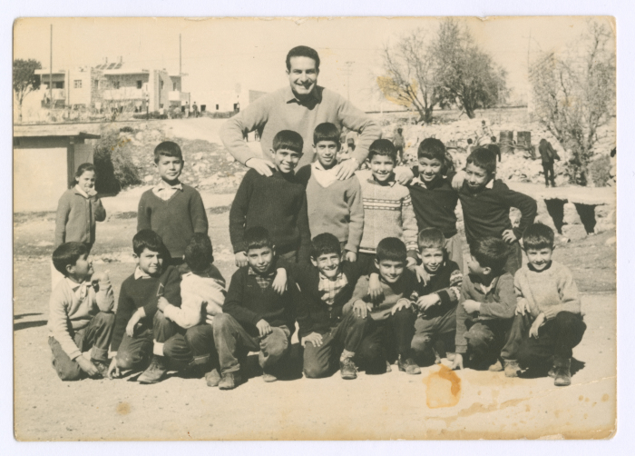 A Photograph of Ali Musa ʿLayan's Children with Colleagues at School
