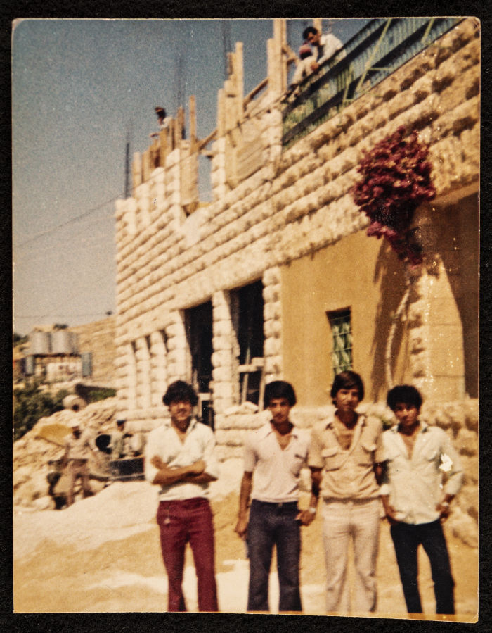 Musa Sanad Standing in front of Artas Secondary School while under Construction  