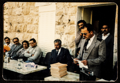 Handing Out Certificates During the Literacy Graduation Ceremony in Artas Village