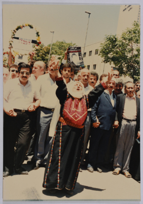 An Elderly Woman Chanting at Shaheed Omar al-Qasim