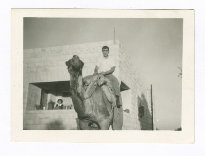A Man Riding a Camel