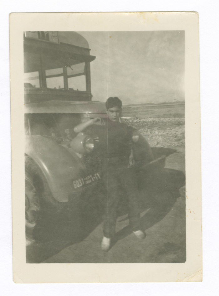 A Young Man in Front of a Bus