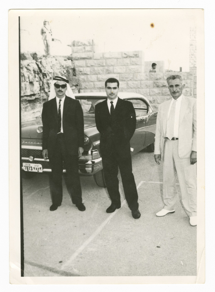 Men Standing in Front of a Car