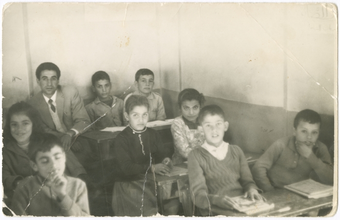 Students with their teacher Hassan Wahsh Sa'ada in a school in Acre