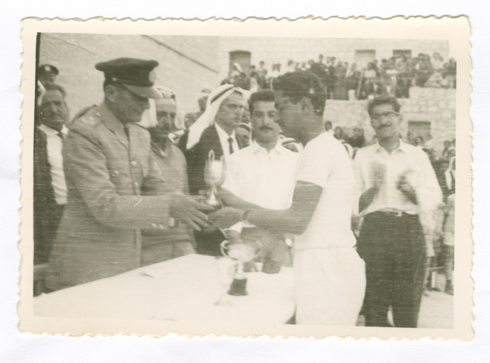 A Photograph Anton Hanna Receiving an Award at a School in Tayibe, Palestine