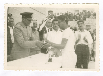 A Photograph Anton Hanna Receiving an Award at a School in Tayibe, Palestine